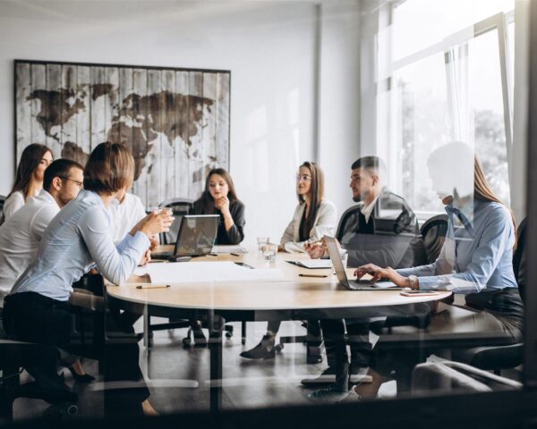 group-of-people-working-out-business-plan-in-an-office (Large)